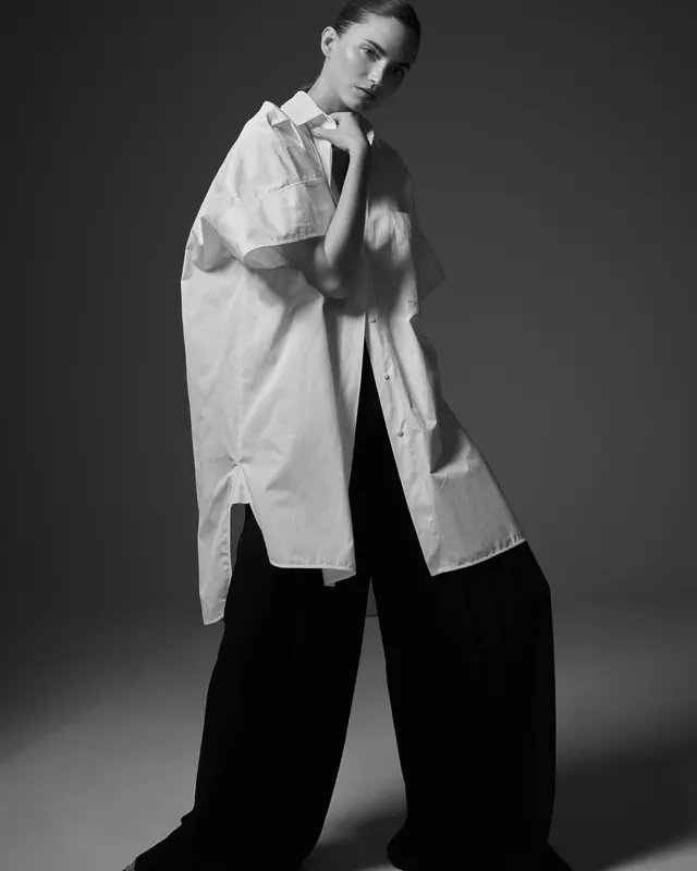Black and white fashion portrait with oversized shirt, photographic, minimal, monochrome