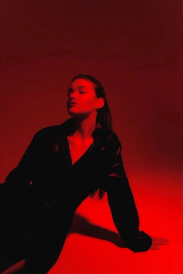 Red monochrome fashion portrait, photographic, dark-mode, dark