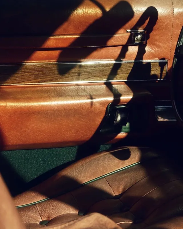 Leather and shadow detail, photographic, minimalist, warm