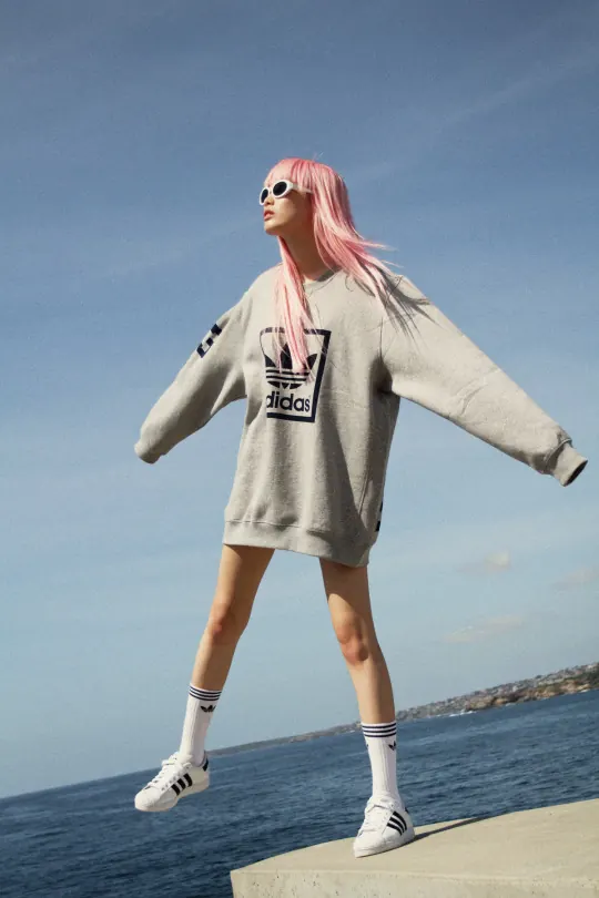 Streetwear fashion portrait with sky background, photographic, cool