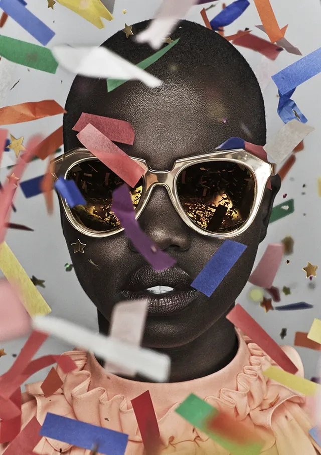 Playful portrait with confetti and metallic sunglasses, playful, maximalist, vibrant