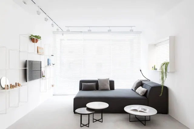 Minimal monochromatic bedroom with low-profile furniture, minimal, monochrome, light