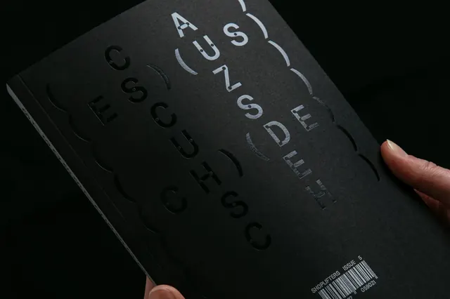 Actual Source black book cover, minimal, technical, dark