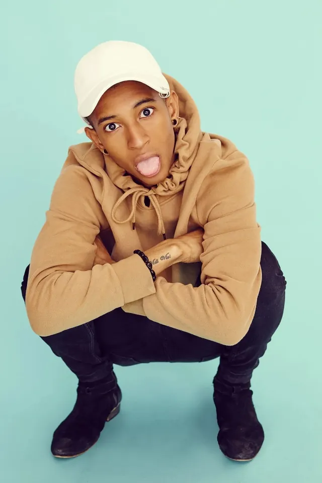 Playful portrait with tongue out and pastel background, photographic, playful, pastel