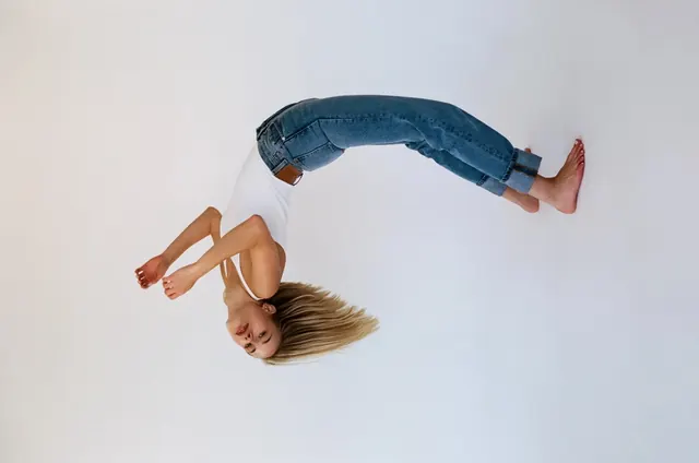 Overhead portrait with jeans and warm tones, photographic, minimal, light
