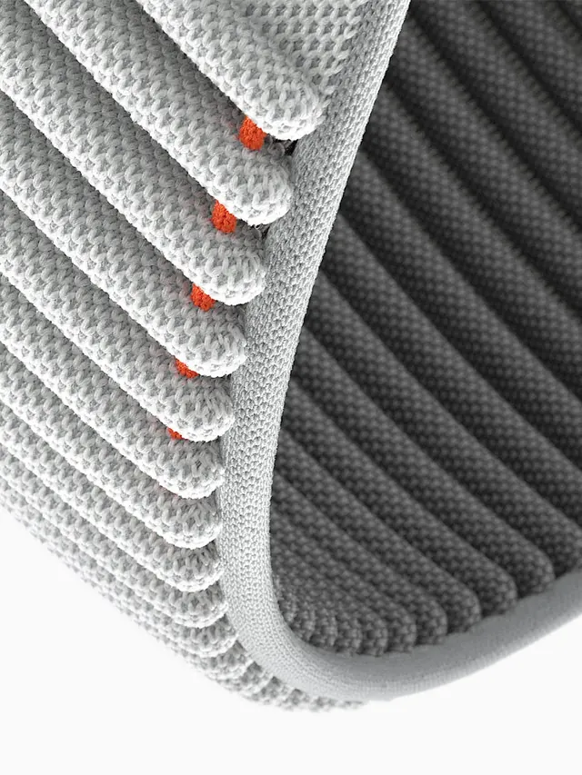 Stacked white and gray knit fabric samples with red buttons, minimal, photographic, light