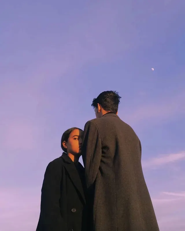 Golden hour dual portrait against purple sky, editorial, photographic, cool
