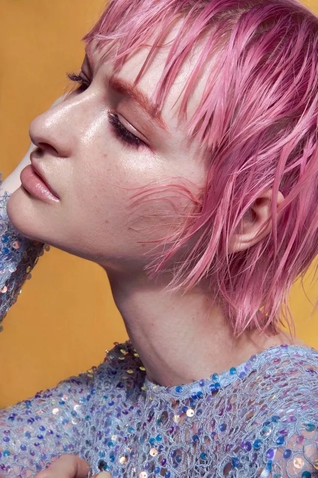 Pink hair on yellow fashion close-up, editorial, photographic, vibrant
