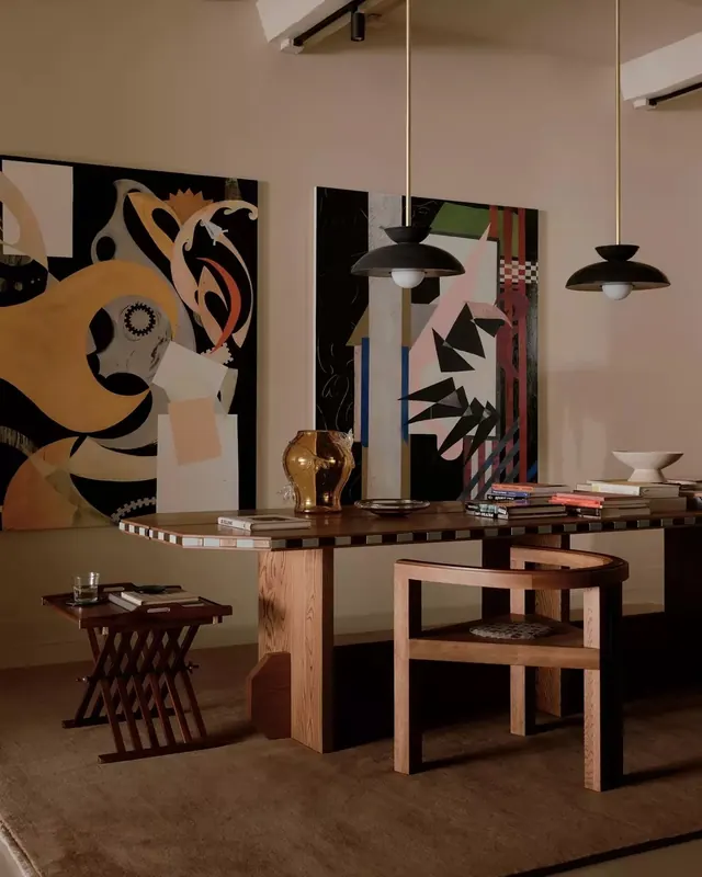 Curated dining room with abstract art, minimal, organic, warm