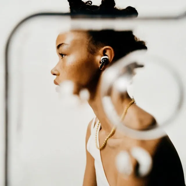 Earbuds profile through glass, minimal, photographic, light