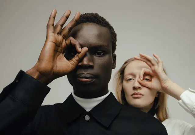 Circular hand gesture dual portrait, minimal, editorial, light