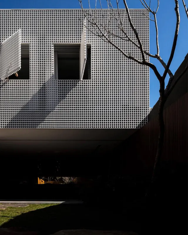 White grid facade with shutters, minimal, geometric, light
