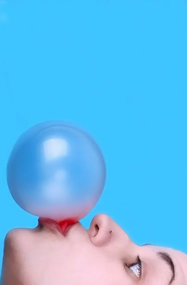 Blue studio bubblegum portrait, photographic, minimal, vibrant