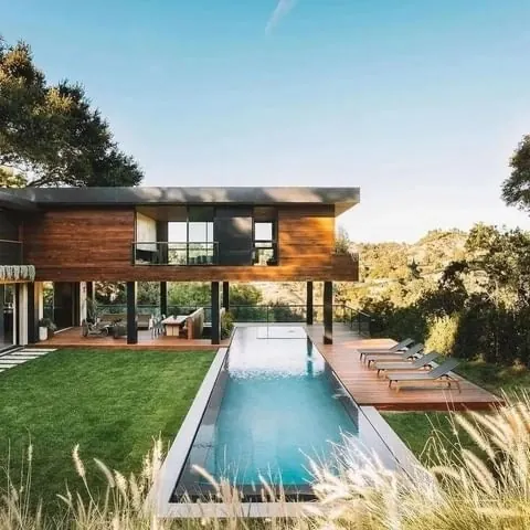 Cantilevered wood house with pool, minimal, photographic, light