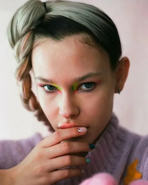 Editorial portrait with neon eye makeup, editorial, minimal, pastel