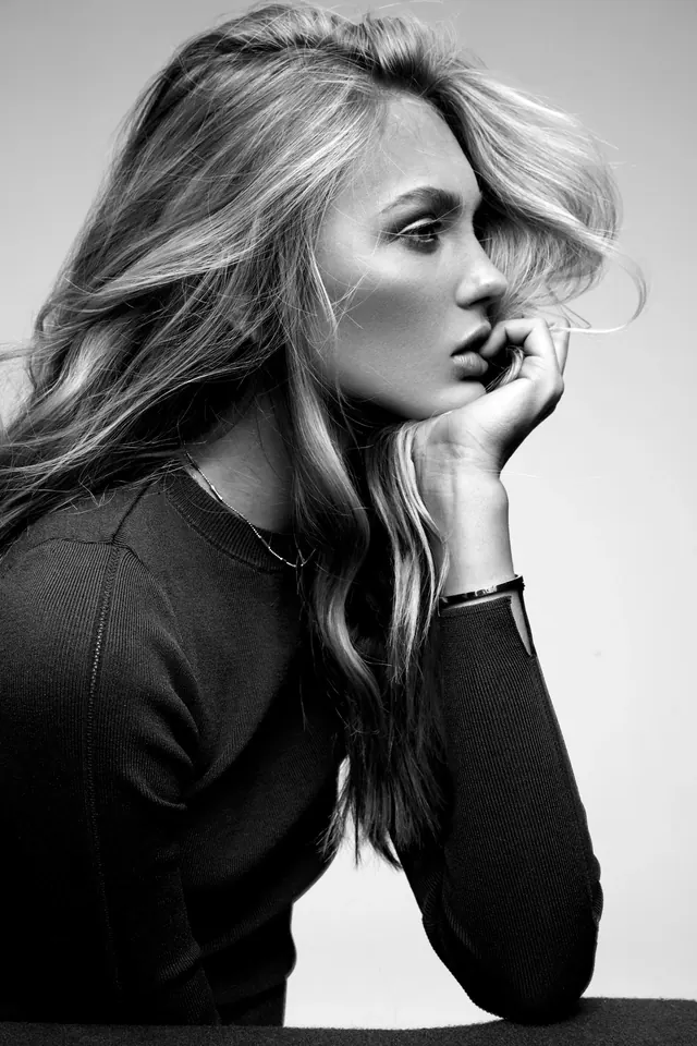 Black-and-white profile knitwear portrait, minimal, photographic, monochrome