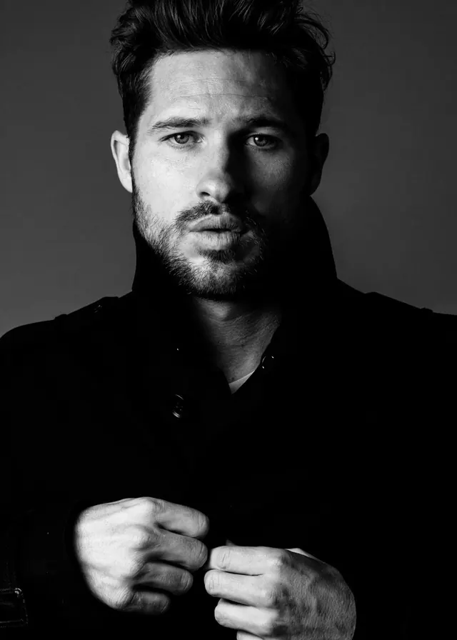 Dramatic male portrait buttoning coat, photographic, monochrome, monochrome