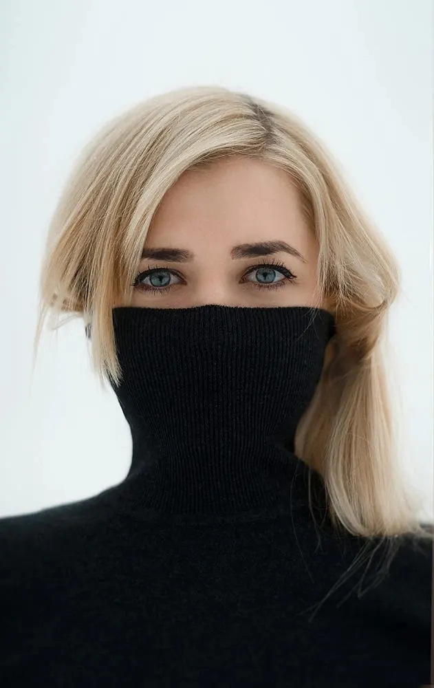 Turtleneck portrait with hidden face, photographic, minimal, light