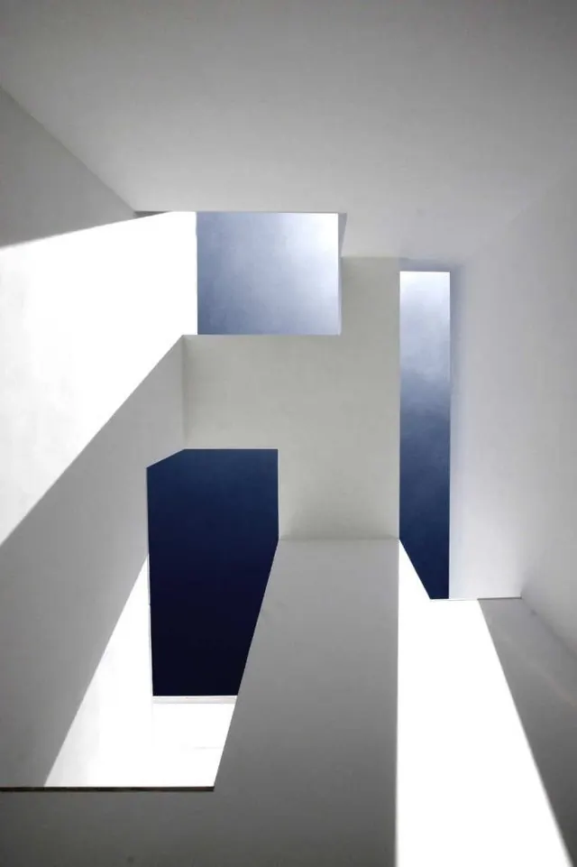 White architectural voids with blue sky, minimal, geometric, light