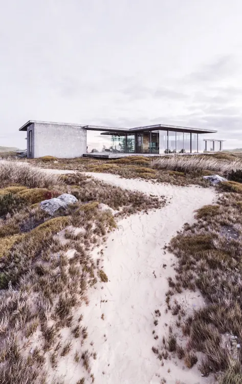 Modernist house in desert landscape, minimal, photographic, muted