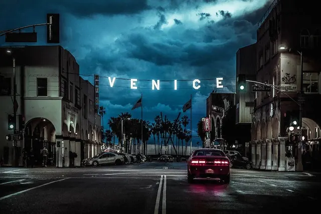 Venice street signage under stormy sky, photographic, editorial, dark