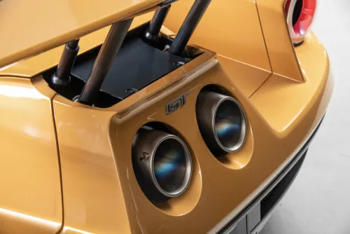 Gold Supercar Rear Exhaust Detail Shot, photographic, luxury, warm