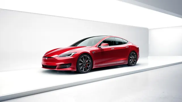 Red electric vehicle in minimal white gallery space, minimalist, corporate-clean, vibrant