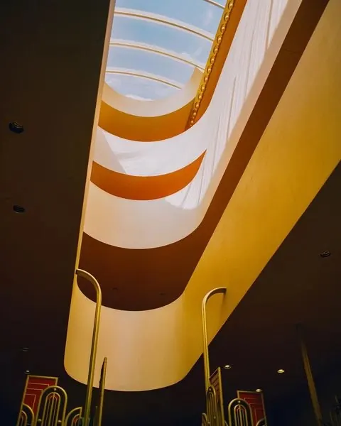 Guggenheim spiral architecture upward view, photographic, minimal, warm