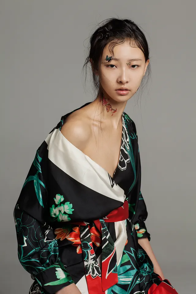 Fashion portrait with floral styling, photographic, dark