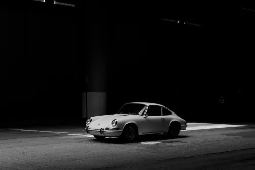 Minimalist Porsche 911 studio shot, minimal, monochrome, monochrome