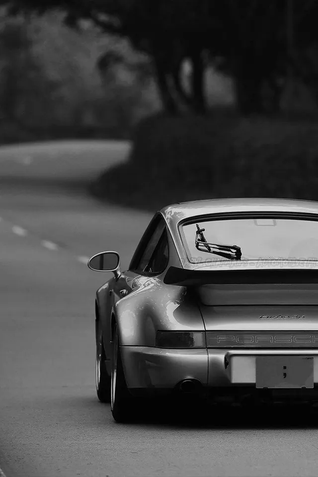 Black and white car detail photograph, photographic, dark-mode, monochrome