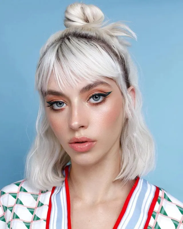 Portrait with platinum blonde styling and bold makeup, photographic, bold, cool