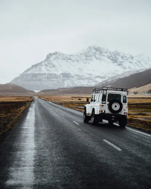 Icelandic landscape with white SUV, photographic, minimal, cool