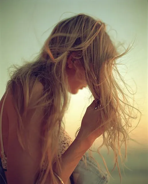 Backlit portrait with warm golden hour glow, photographic, editorial, warm