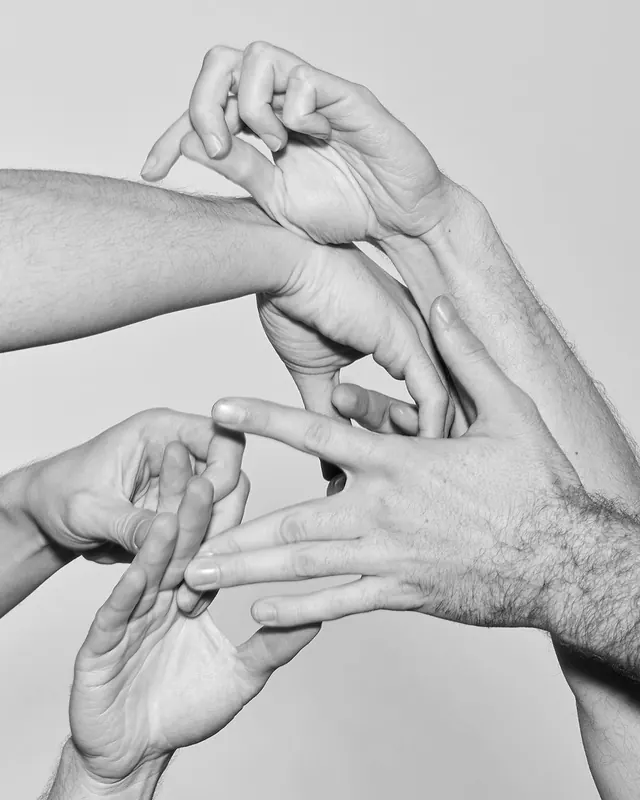 Multiple hands intertwined – intimacy study, photographic, editorial, monochrome