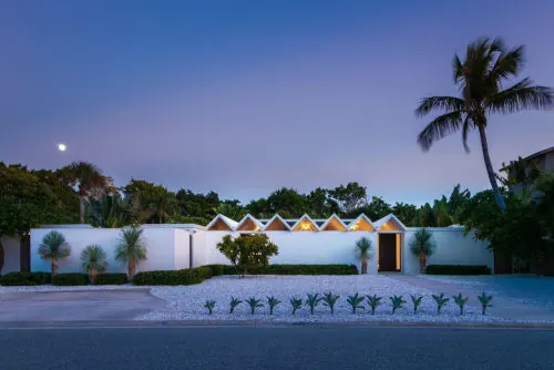 Minimalist white courtyard with desert landscaping at dusk, minimal, architectural, cool
