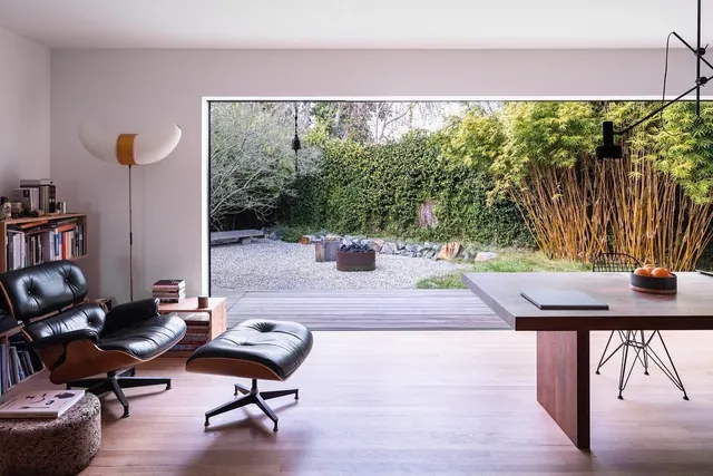 Minimalist modern interior with floor-to-ceiling window, photographic, minimalist, light