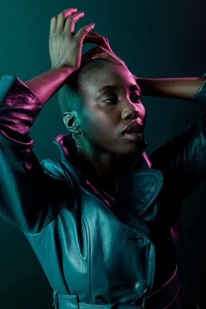 Dual-tone portrait with cyan-magenta lighting, photographic, dark-mode, dark
