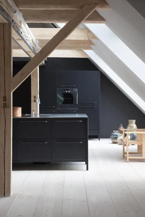 Modern kitchen interior with black cabinetry, photographic, minimal, monochrome
