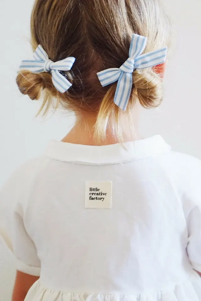 Rear view portrait with blue striped bows, photographic, light-mode, light