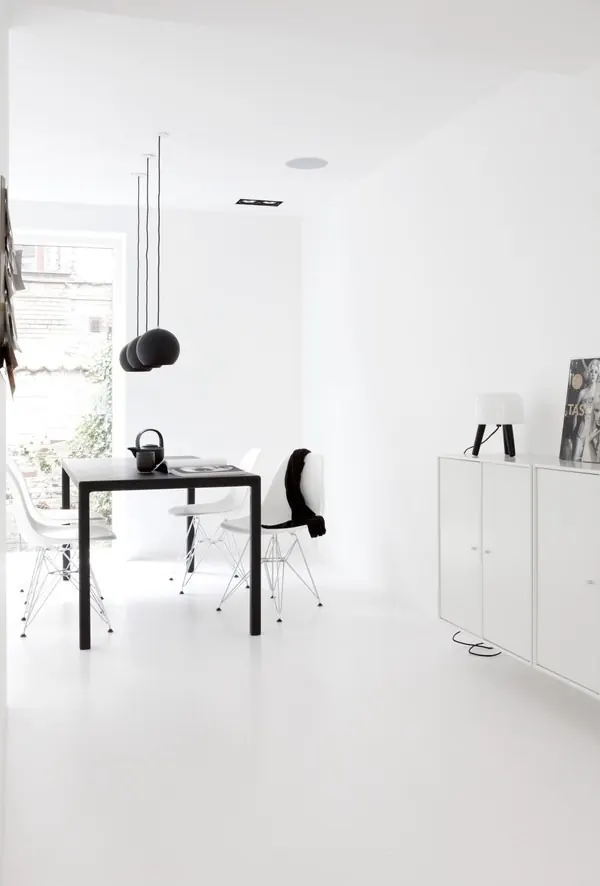 Bright minimalist white dining interior with black accents, minimal, light-mode, light