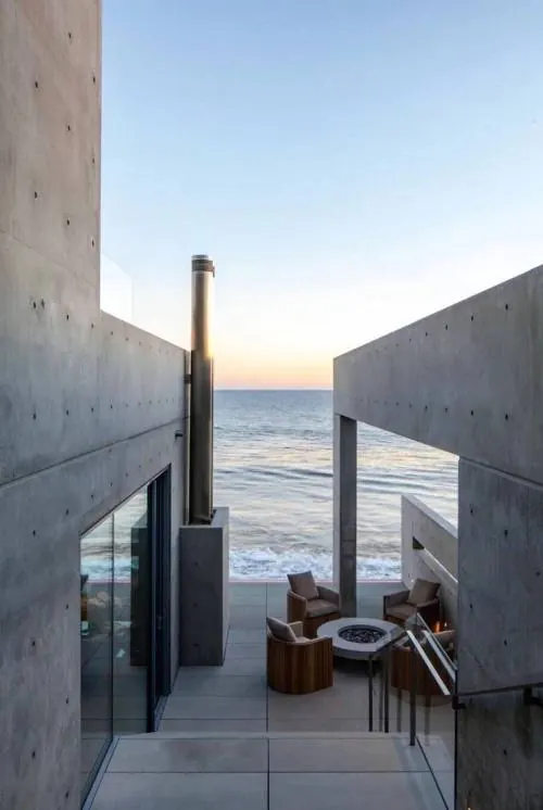 Concrete beach house patio at sunset, minimal, editorial, light