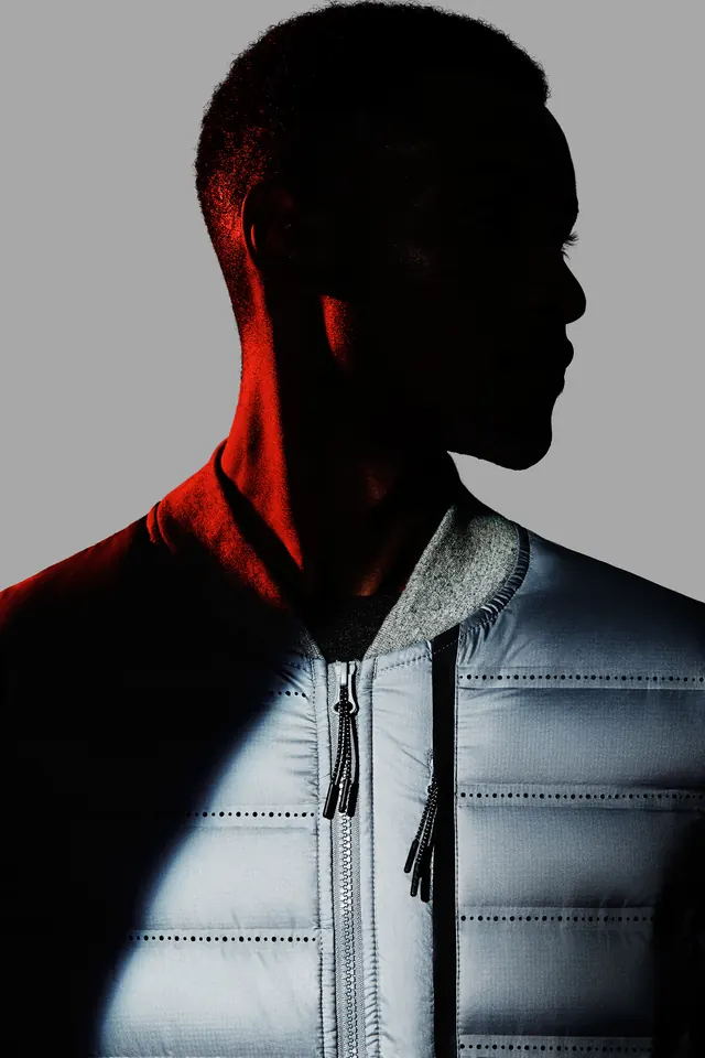 High-Contrast Portrait of Person in Quilted Jacket