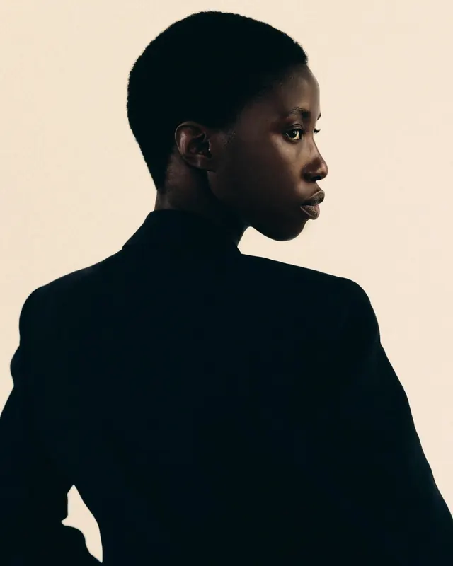 Fashion portrait of model in black turtleneck, photographic, editorial, dark