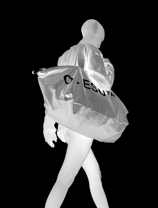 Monochrome Figure with Large Bag