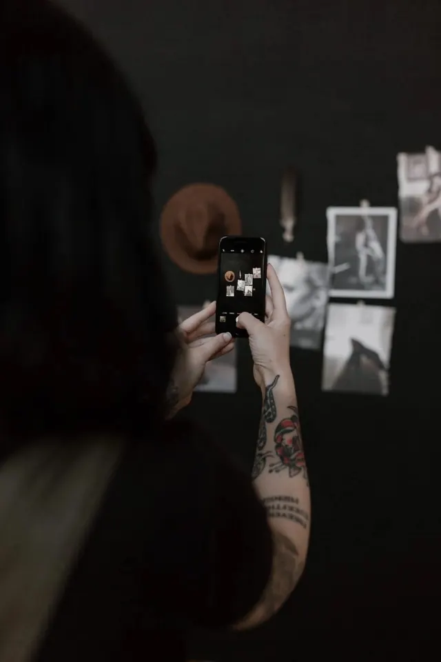 Buffalo Collective gallery wall on phone, minimal, photographic, dark