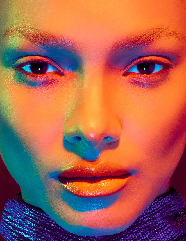 Lais Ribeiro close-up with multicolored lighting, photographic, editorial, vibrant