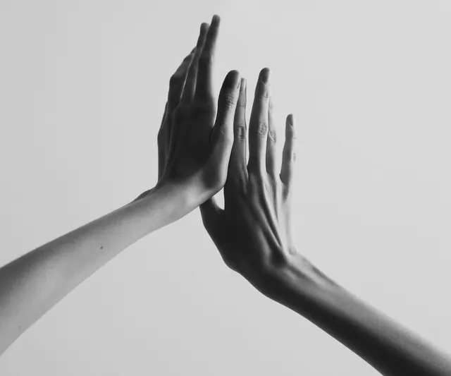 Hands Reaching Toward Each Other