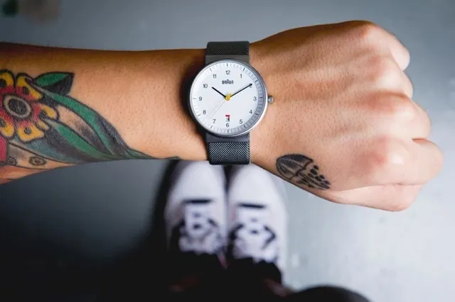 Wristwatch and Tattoo Close-up