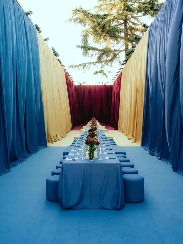 Outdoor banquet table with colorful drapes, photographic, cool